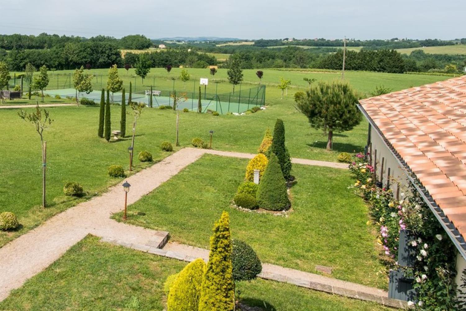 Garden in France with private tennis court