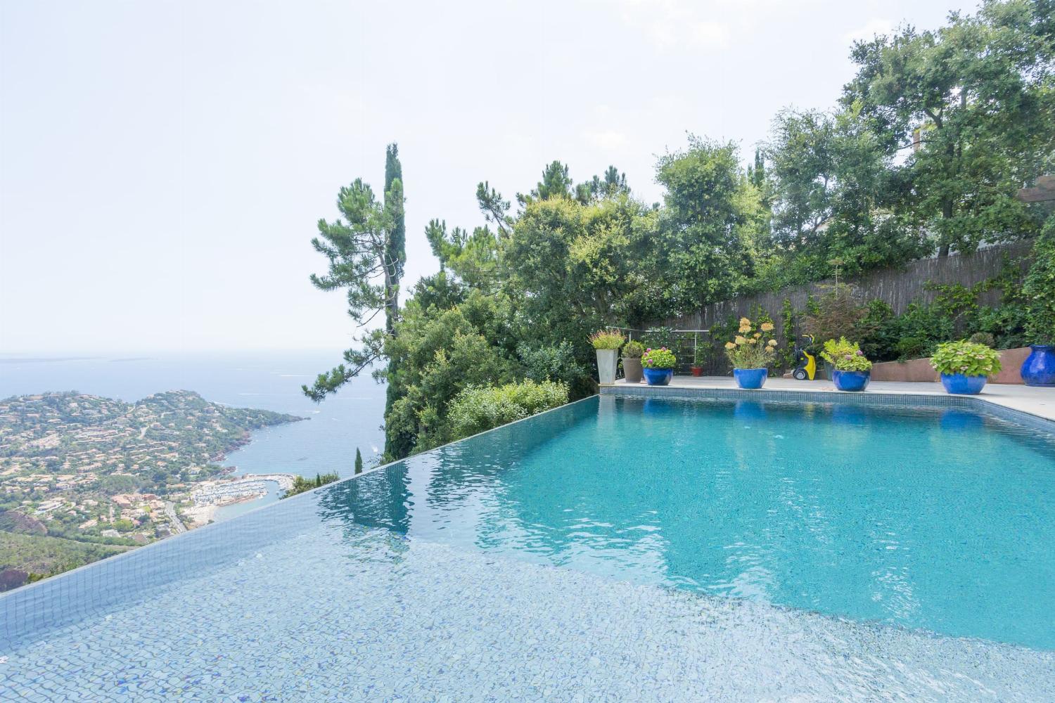 Private heated infinity pool with sea view