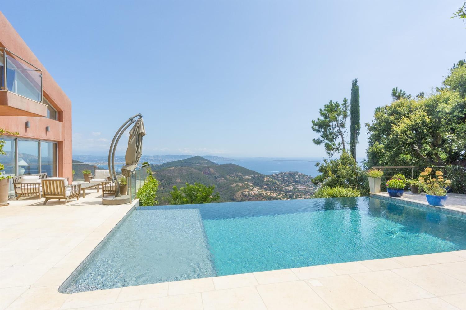 Private heated infinity pool with sea view