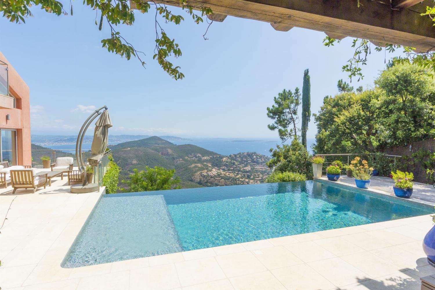 Private heated infinity pool with sea view