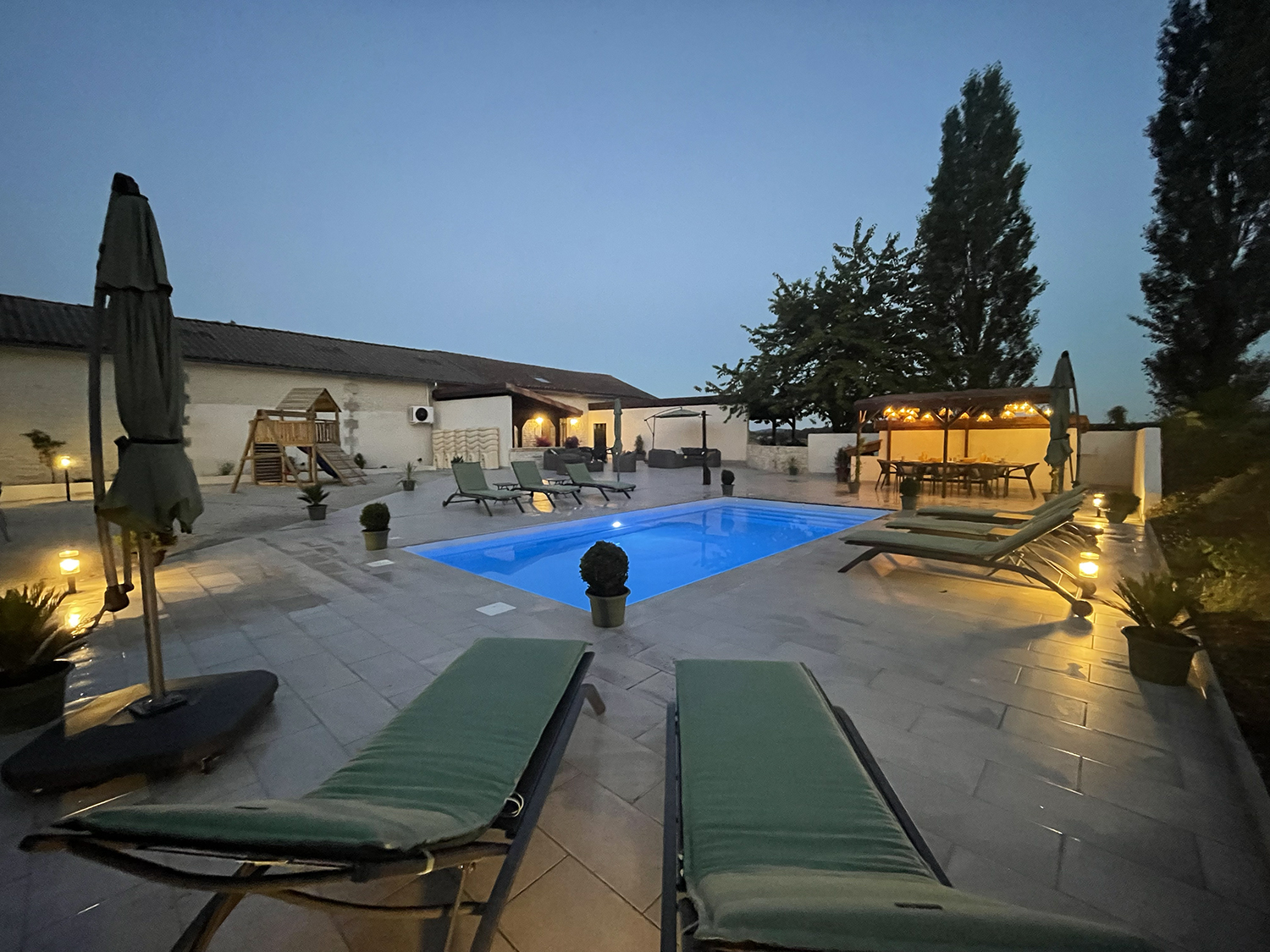 Private heated pool at night