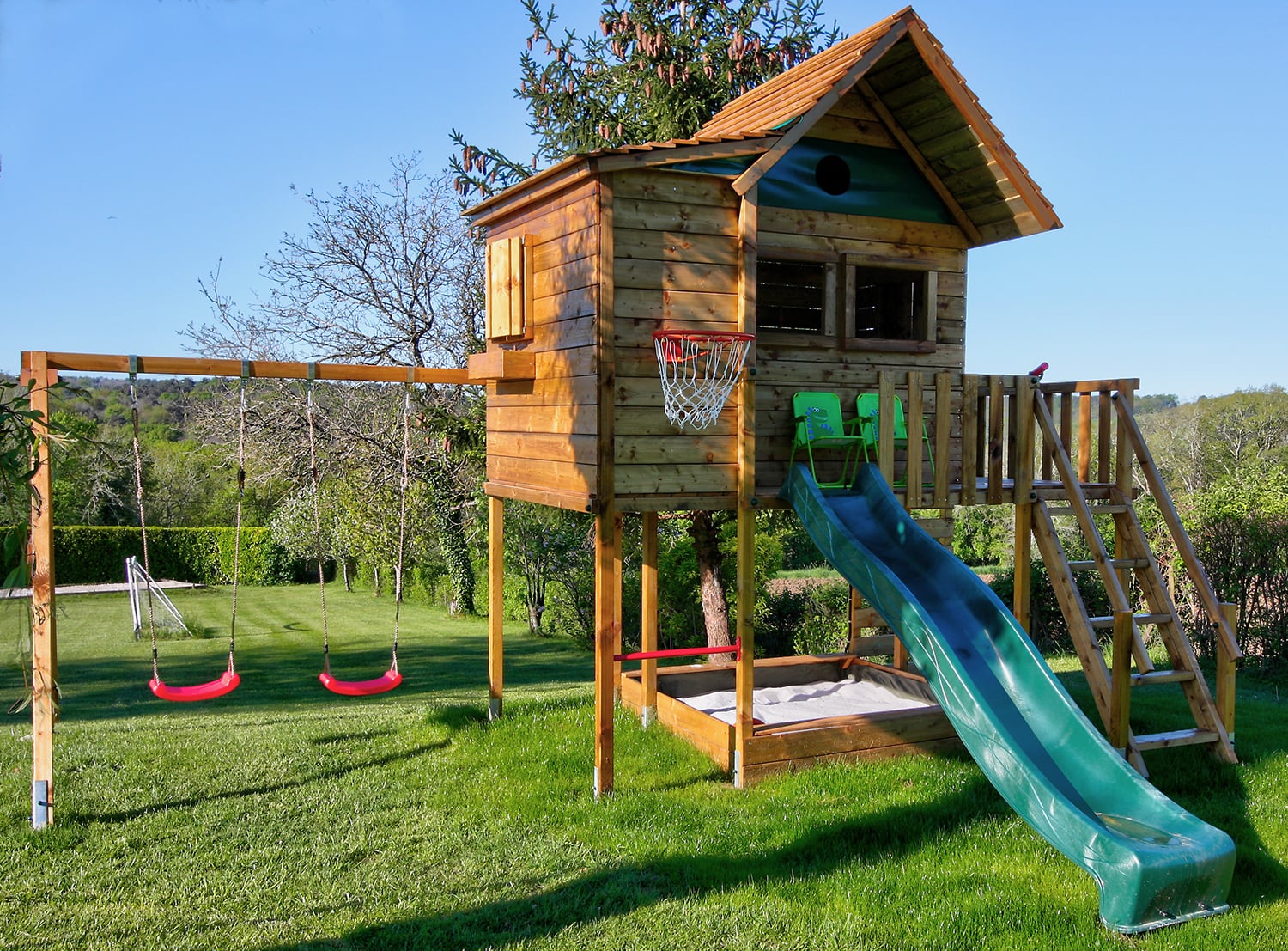 Swings and slide in garden