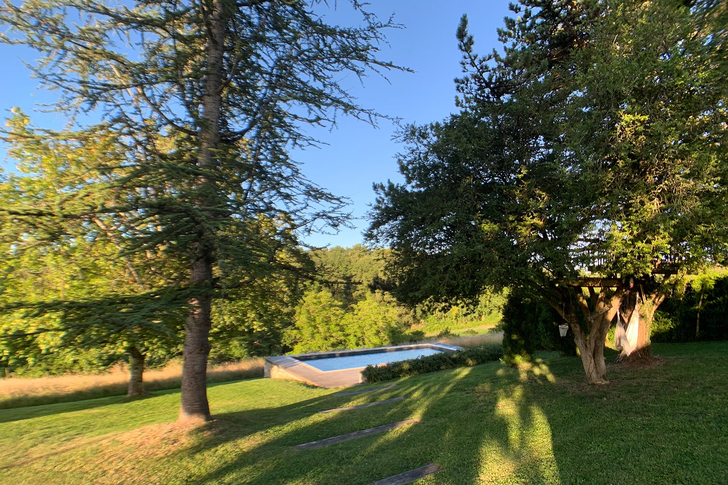 Lawned garden with private pool