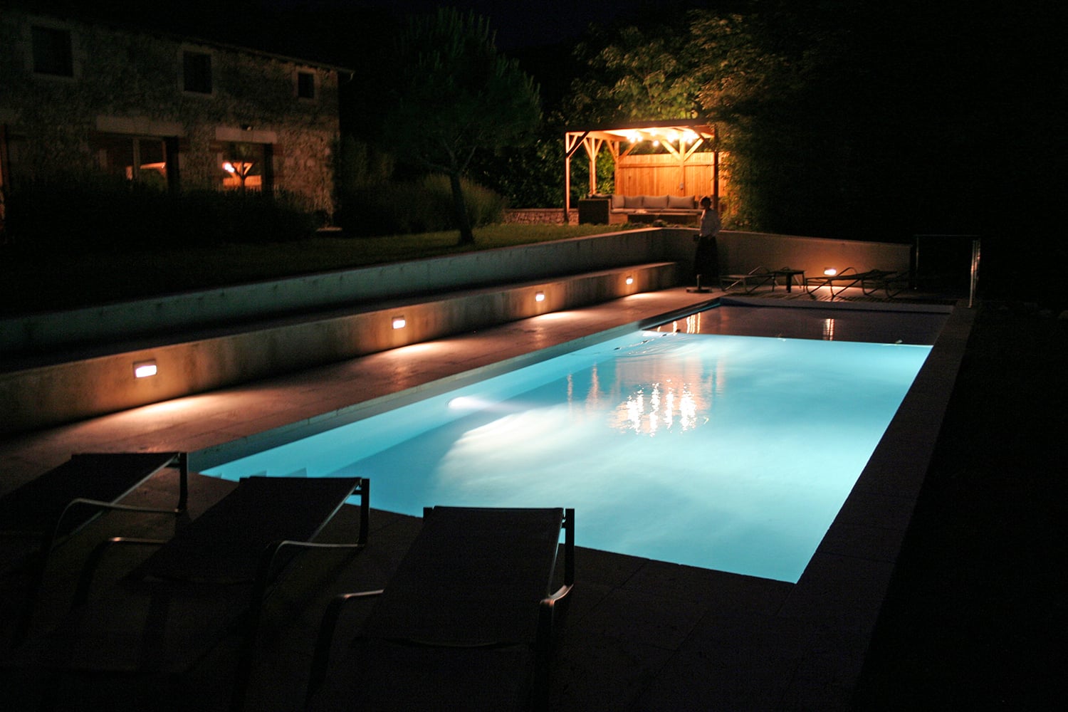 Private heated pool at night